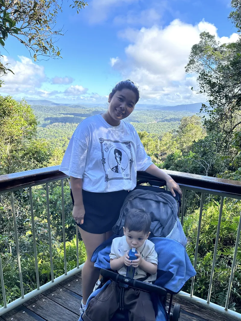 A woman with a toddler in a stroller at the Red Peak lookout