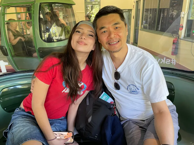 A girl and a man sitting in a gondola