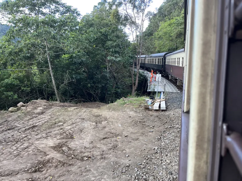 The train curving round the hillside ahead