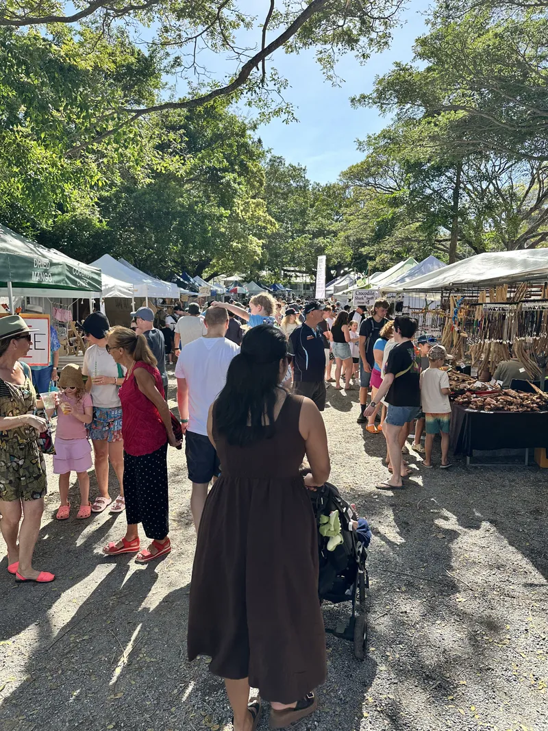 Crowds walking between the stalls at the Sunday markets