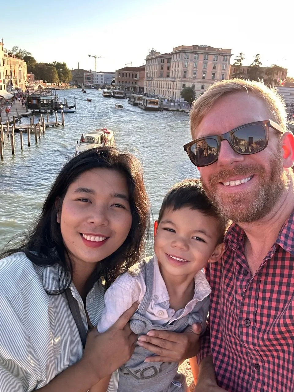 Chris, Ericka and Jaxon taking a selfie by the Grand Canal in Venice