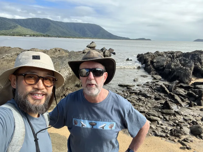 The two men on the rocky shelf at low tide