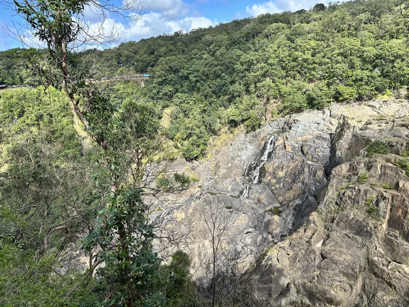 The falls and the rock face across the gorge