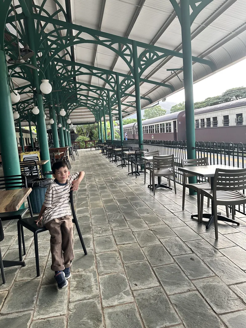 The boy on the chair on the long station platform