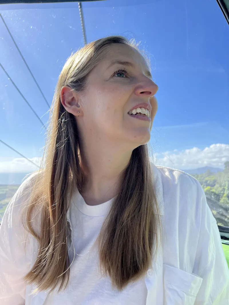 A woman looking up out of the gondola