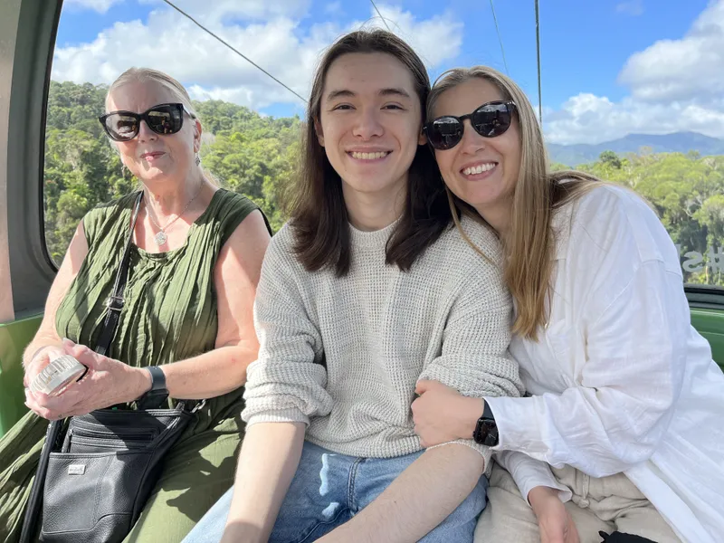 A woman, a teenager and a young woman in the gondola on the last leg