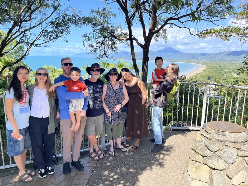 The group at the lookout with the beach behind