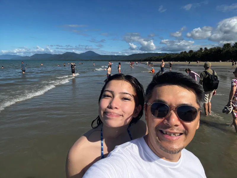 A selfie of the girl and a man on the beach