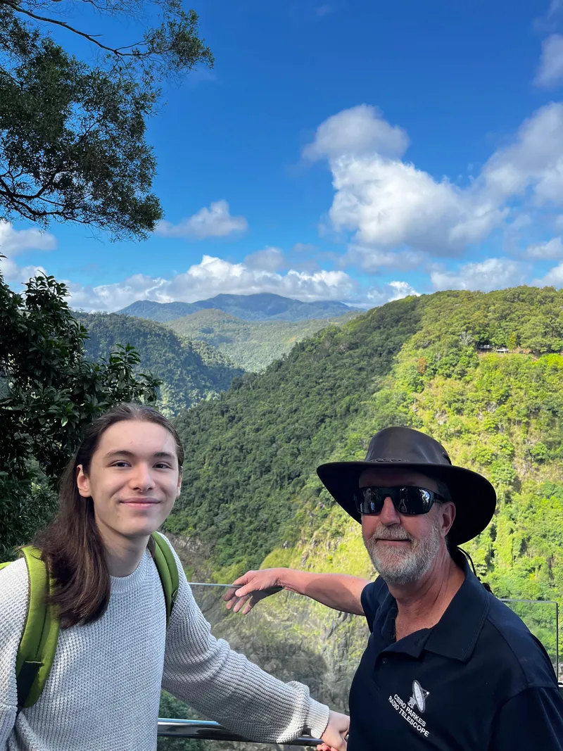 A teenager and a man in a bush hat at the lookout
