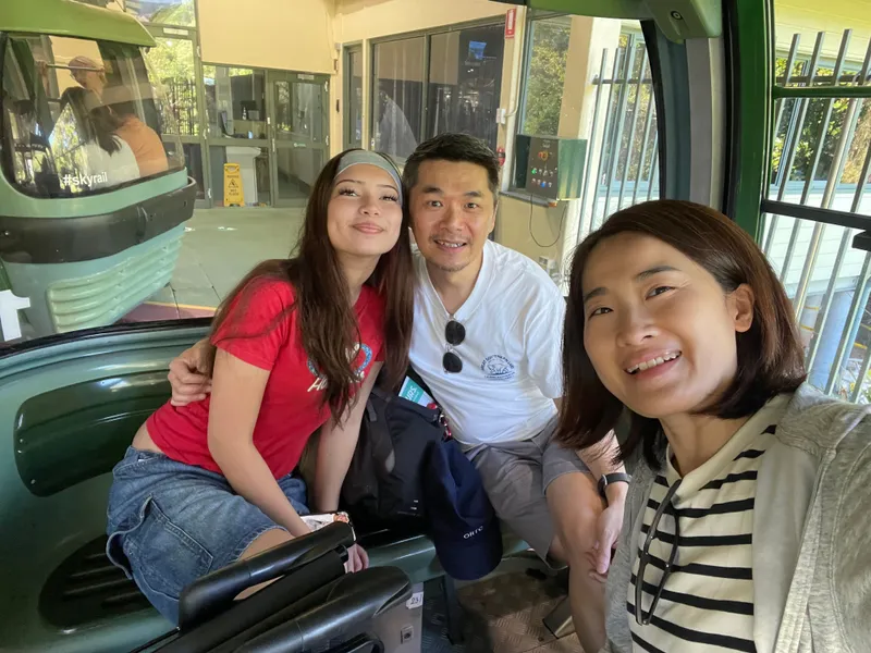 A selfie of three people in a gondola at the station