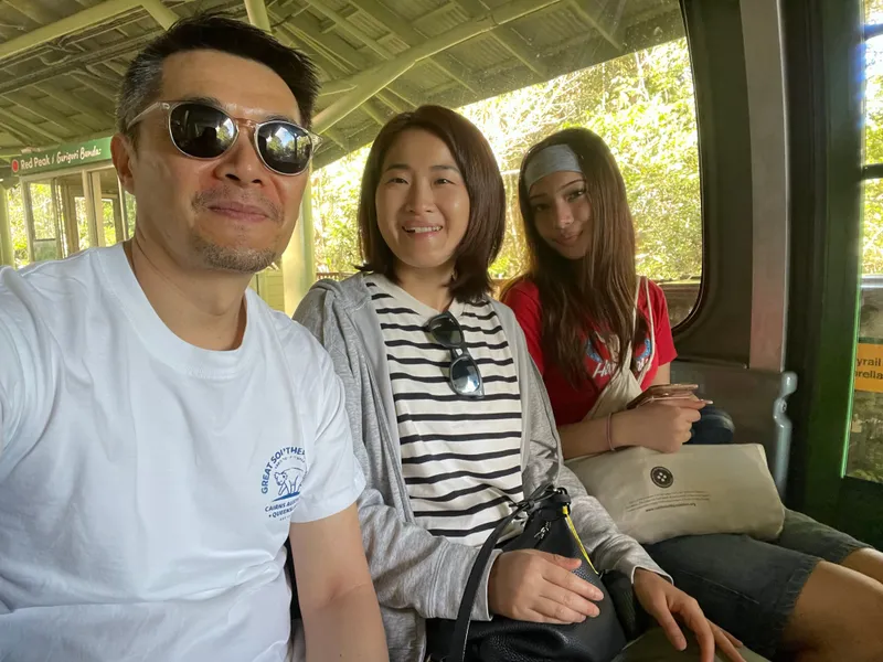 A selfie of three people in the gondola after Red Peak