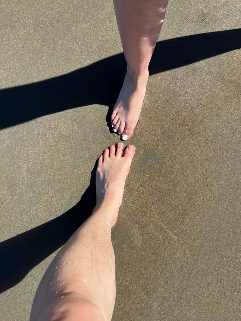 Bare feet on the wet sand