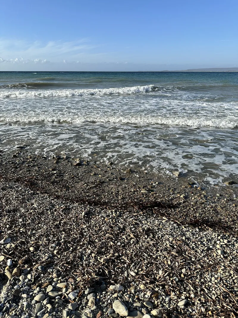 Waves breaking on the pebbly shore at Anzac Cove