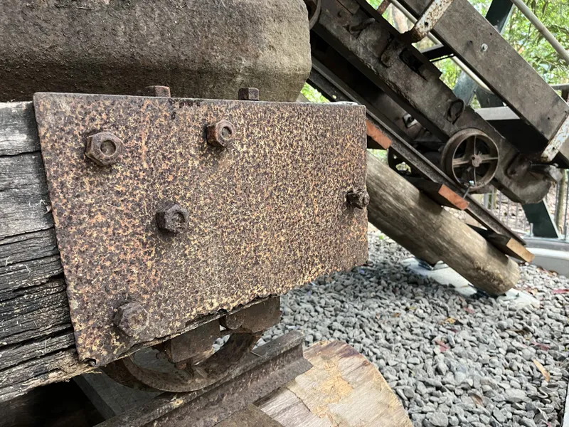A close-up of the rusty iron plate on the old trolley