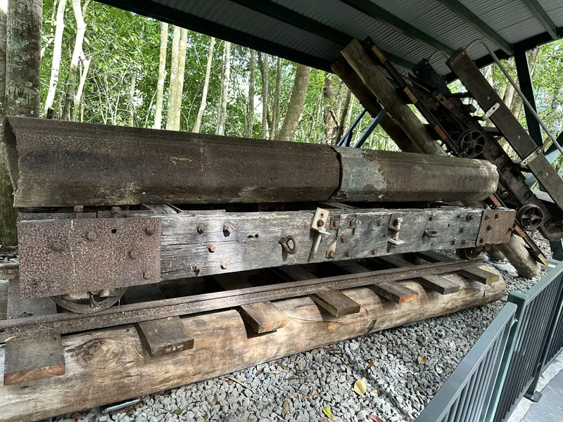 An old timber-hauling trolley on rails at the Barron Falls station