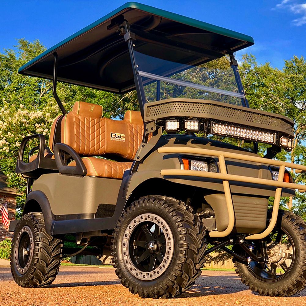 Fully customized lifted four-seat golf cart with oversized wheels, off-road tires, custom seats and LED light bar