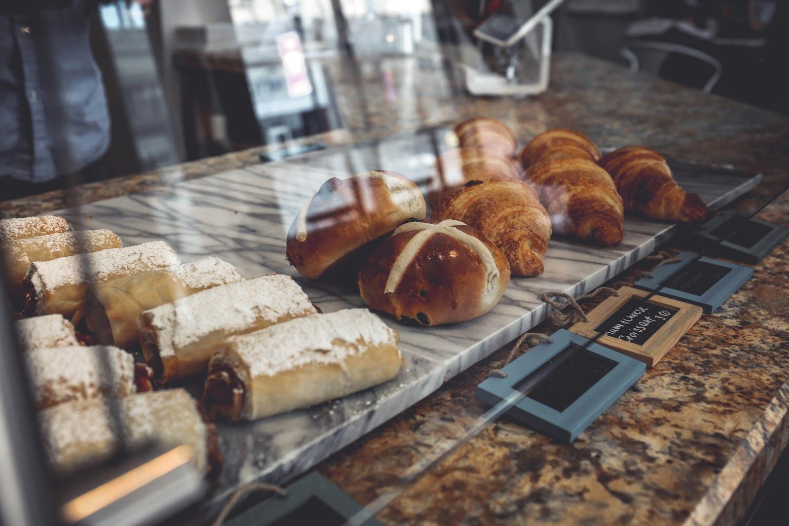 Pastries and fresh baked goods displayed at a bakery counter