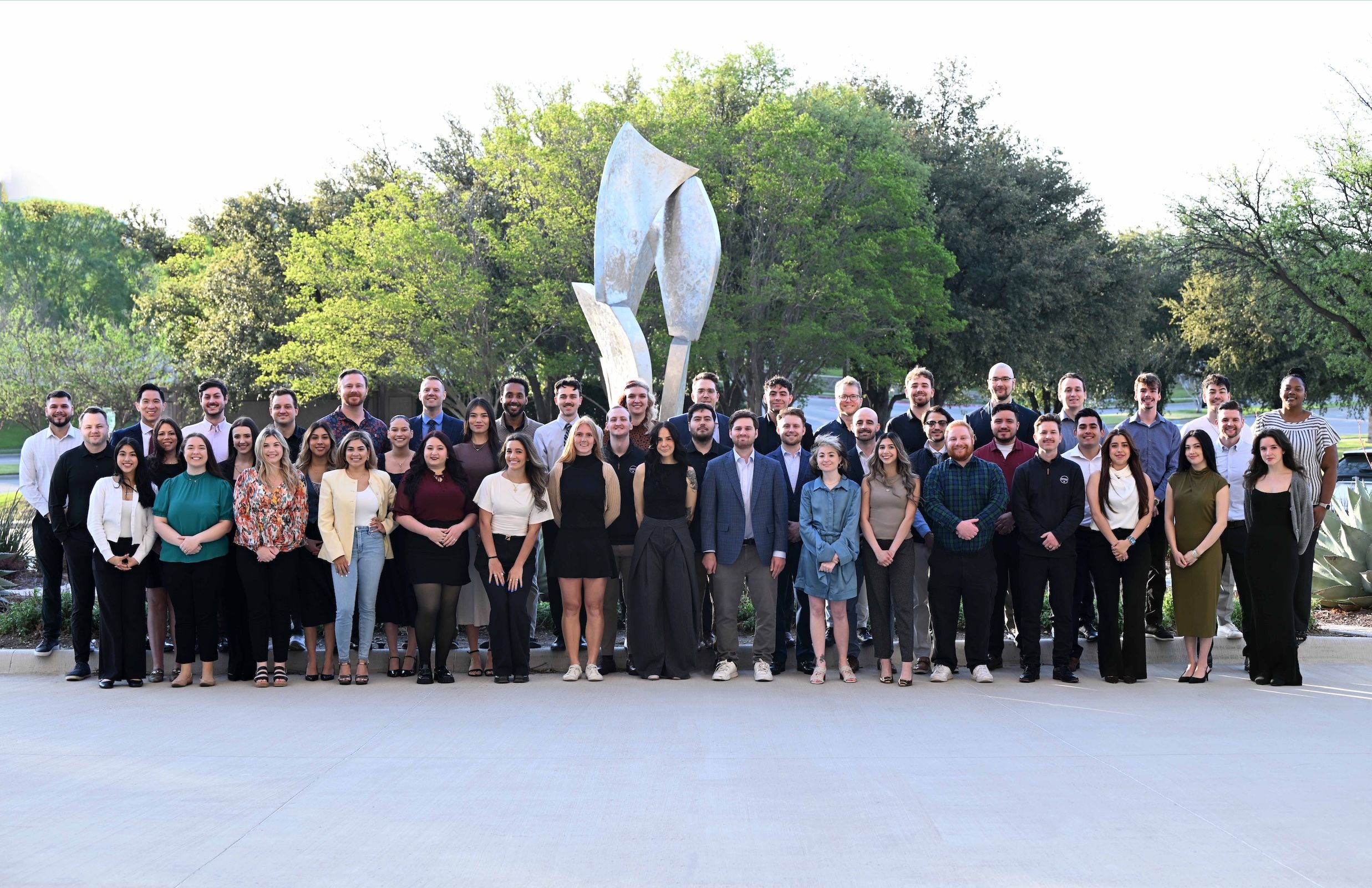 Cherchenko Insurance Agency team gathered for a group photo outdoors