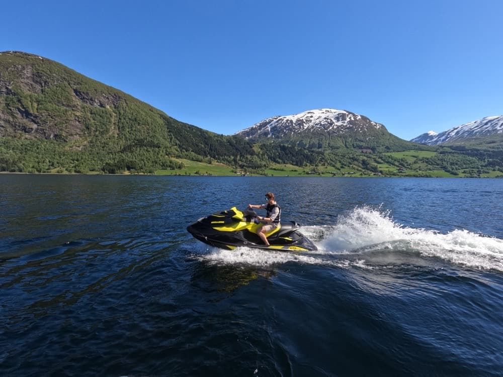 Jet Ski personal watercraft riding across a lake