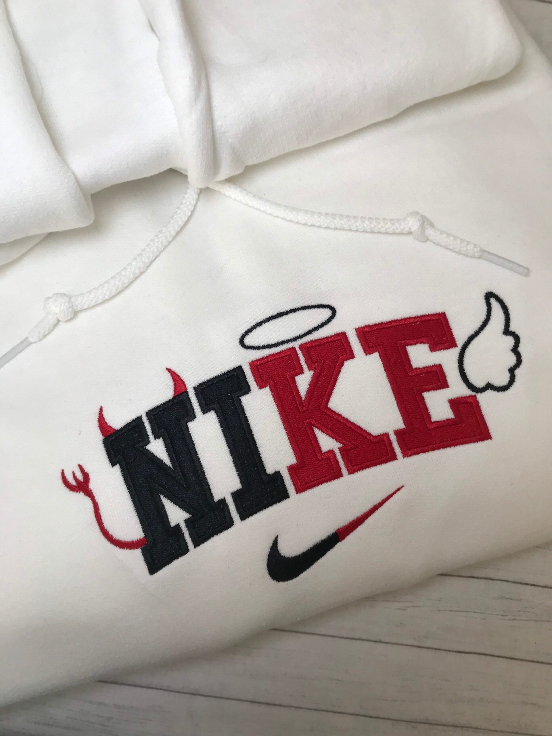 Unique Embroidered Nike Logo Angel And Devil Nike Halloween Sweatshirt