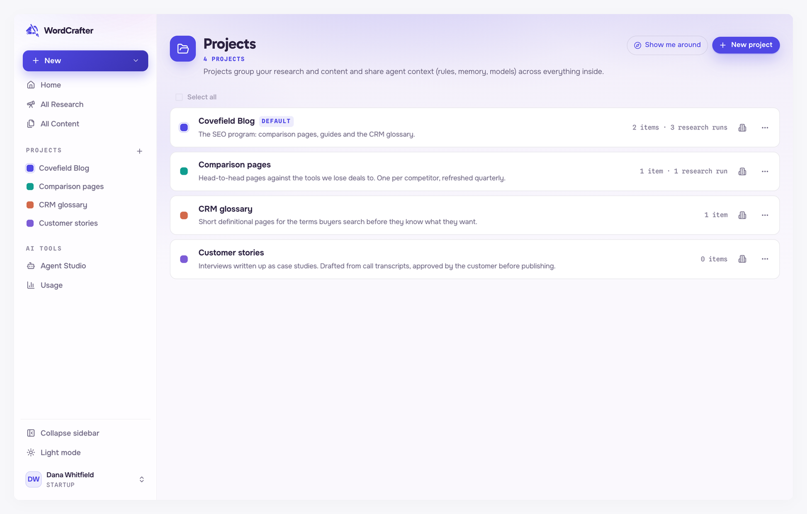 The Projects page listing four projects, each with a color, a description and a count of content, plus a count of research runs where there are any, the first marked Default