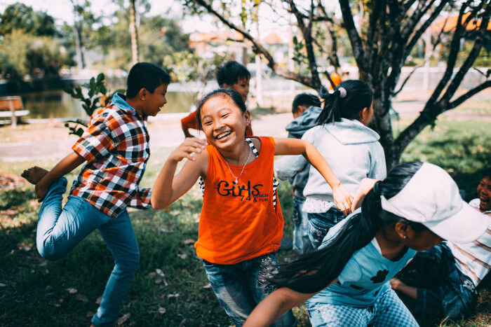 Children laughing and running outside