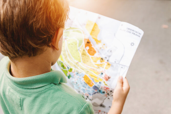boy reading a map