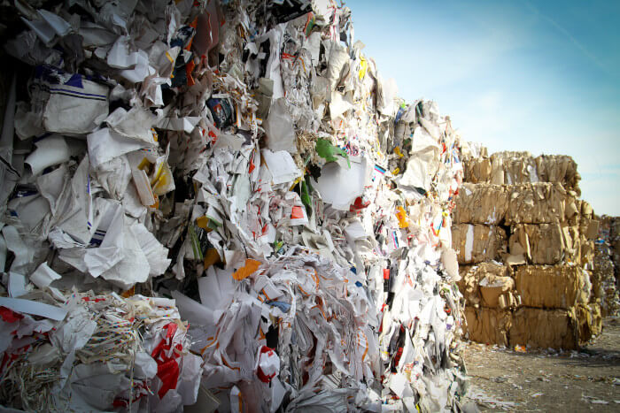 piles of compressed cardboards ready for recycling