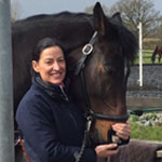 Woman stood with bay horse