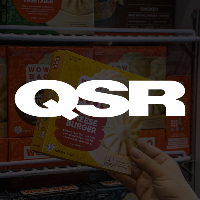 QSR logo over a box of cheeseburger bao