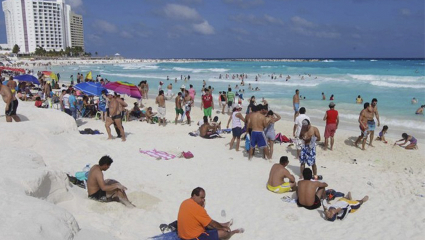 Tras viaje de graduación a Cancún, 30 estudiantes poblanos se contagian de COVID-19