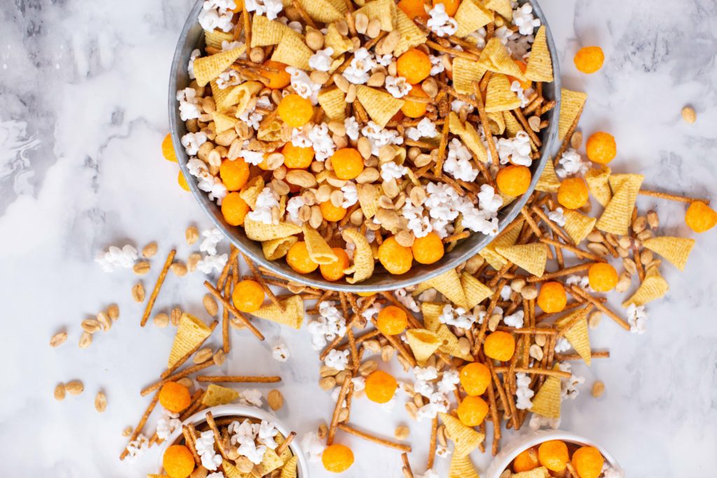 Snack mix with cheese balls, popcorn, pretzels and Bugles