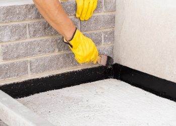 Application of damp proofing paint