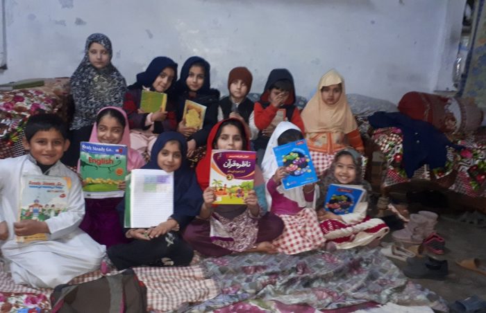 Children holding their books in Mardan, Pakistan