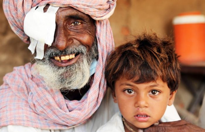 Smiling sardar with son after cataract eye operation in Pakistan