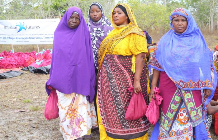 Ladies in Tanga province, norther Tanzania, pose as they recieve their foodpacks.