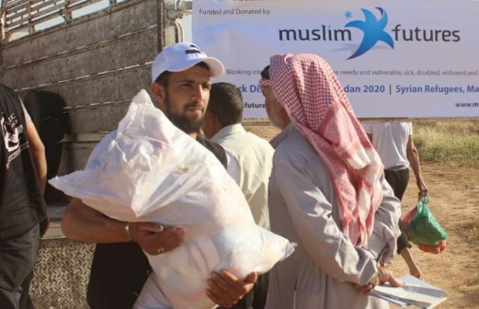 Muslim Futures foodpacks in Jordan for Syrian Refugees being carried away