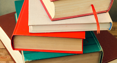 Bunch of books on wooden table