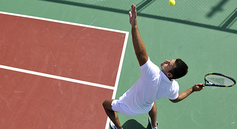 young man play tennis outdoor