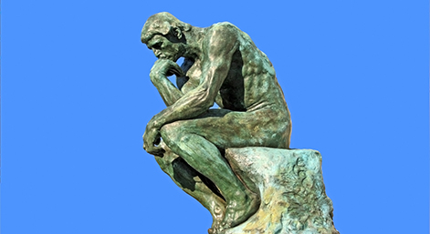 Thinker isolated over blue