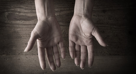 Hands and grainy wood