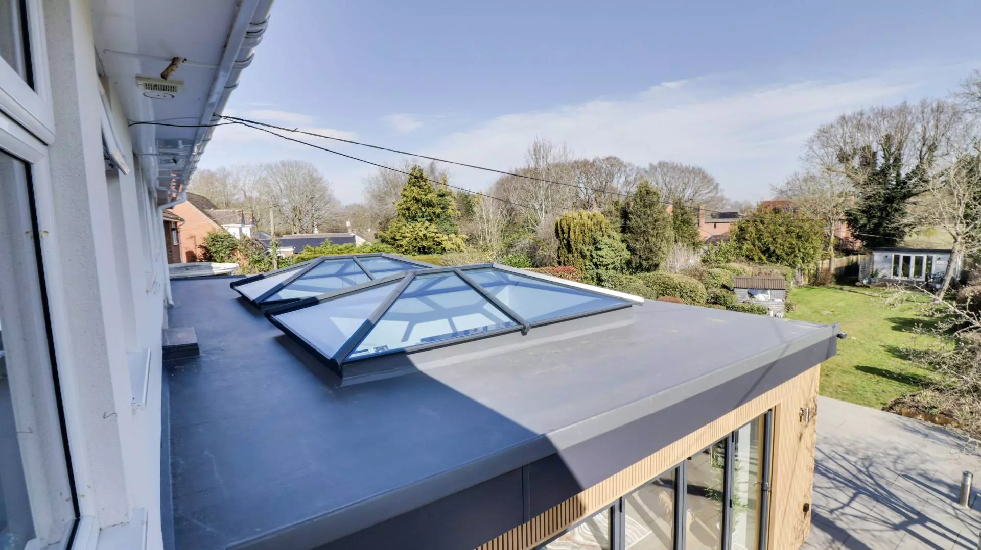 Orangery extension with twin roof lanterns and flat roof