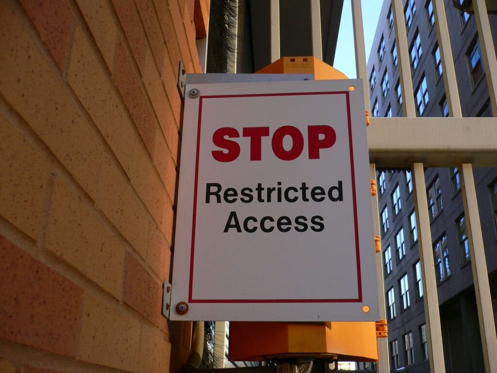 A poster with the text: "STOP Restricted Access"