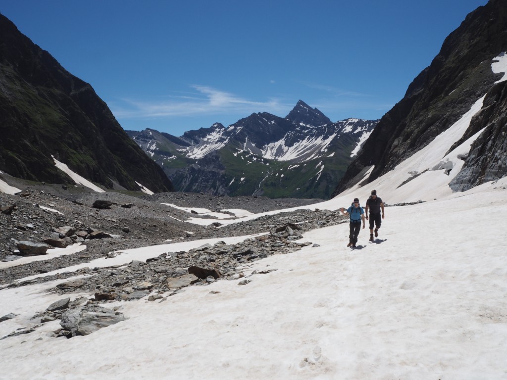 Snow patches and moraine on the glacier leading to the Gonella refuge