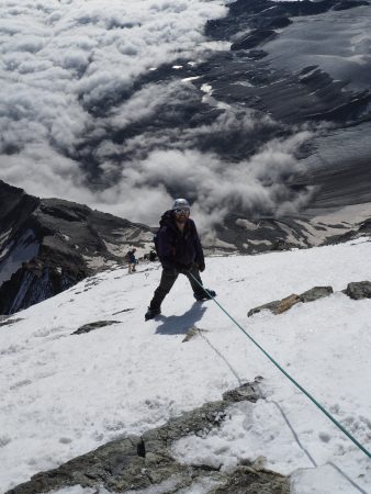 Lowering Rob on the snow slopes of the shoulder