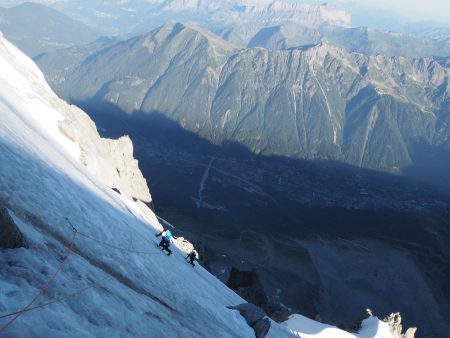Starting the traverse leftwards around the top rock buttress