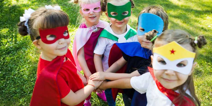 Kids dressed up as heroes with masks and capes.