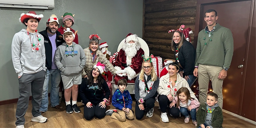 Guests with santa during the holidays.