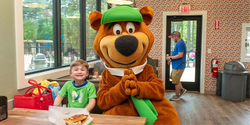 Camper with Yogi Bear™ at the Campfire Canteen.