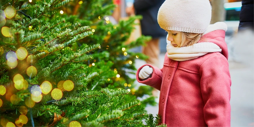 Child with a Christmas tree.